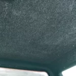 Interior view of a truck bed cap from Canyon State, showing a padded headliner on the ceiling.