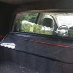 Interior view of a truck bed cap from Canyon State showing a sliding rear window and cabin.