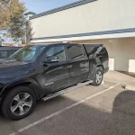 Black RAM truck with a Ranch Echo cap parked outside Canyon State RV.